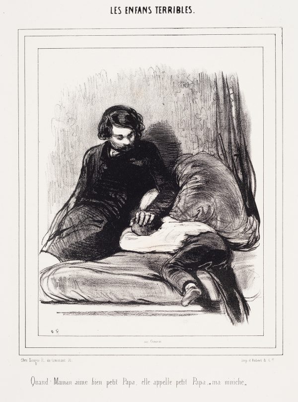 A man sits with his hand on the head of a boy who is crying.