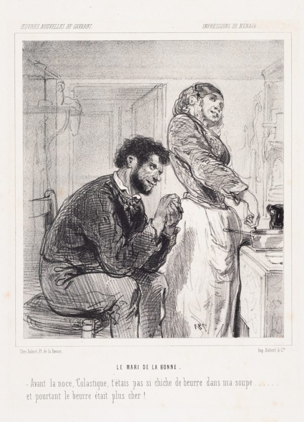 A man sits behind a woman cooking. His hands are clasped and both are smiling.