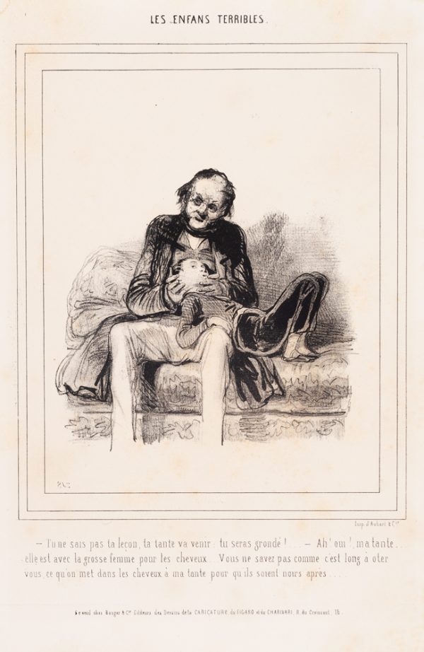 A seated man holds a small boy's head. The boy is laying on a couch and across the man's knee.