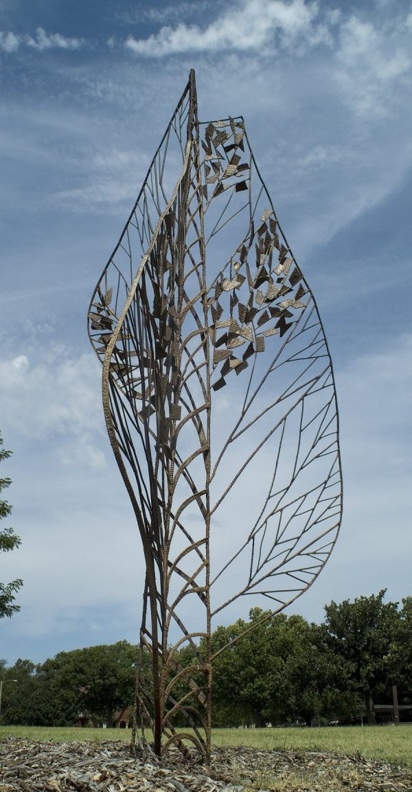 A stylized tree. This sculpture was a Camp Fire Girls project, whereby the members donated pennies toward the purchase of this tree. The Camp Fire Girls were known for planting trees in Wichita.