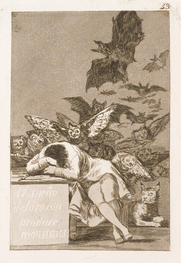 Bat with owl-like faces swirl around a man seated with his head in his arms, sleeping.