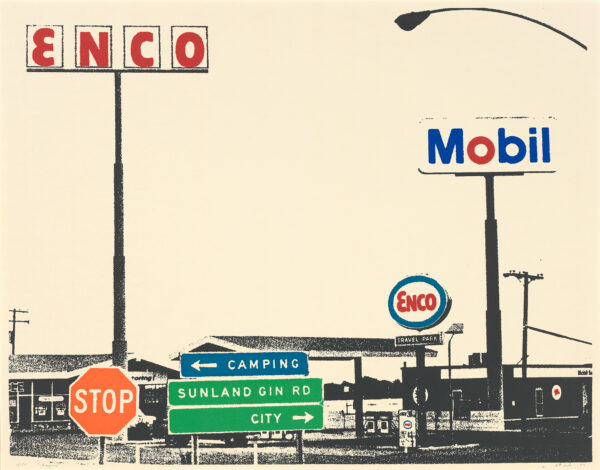 Scene with two gas stations with signs against a pink sky.