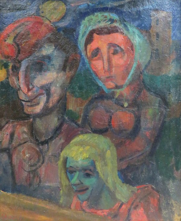 A view of three people in the audience who have different colored faces. The small girl in the front has a blue face with yellow hair. The woman behind has a pink face with a blue bonnet. The man a tleft wears an orange hat.