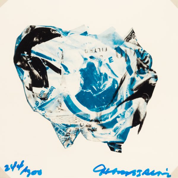 An image of a crumpled paper printed in white, blue and black.