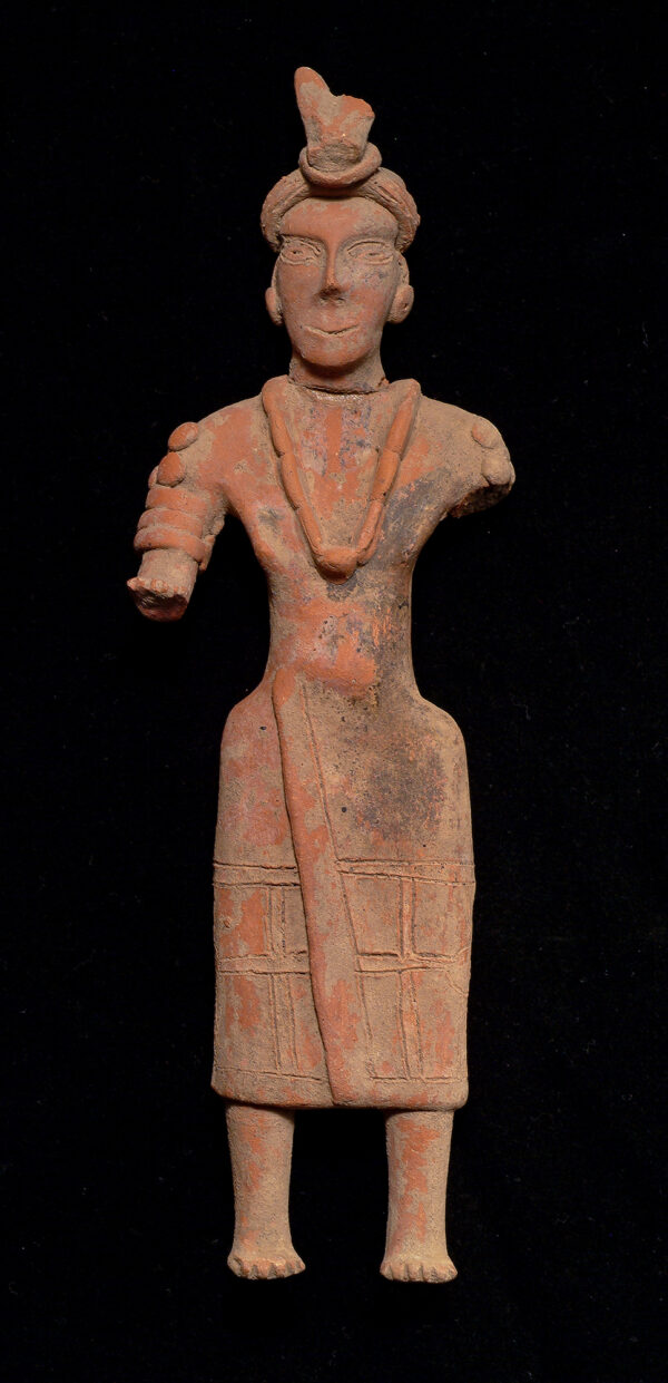 Standing gingerbread female figure with headdress, necklace.