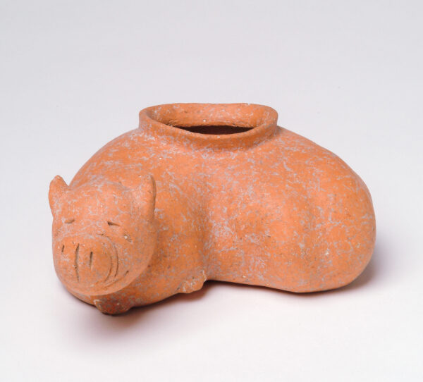 Vessel in the shape of a curled up dog.