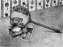 A hand mirror reflects a jewelry box and reproduction by Mary Cassatt.