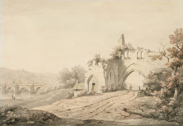 At right, view of abbey ruins with dirt road passing beneath Gothic arch of ruins; river with bridge in left distance.