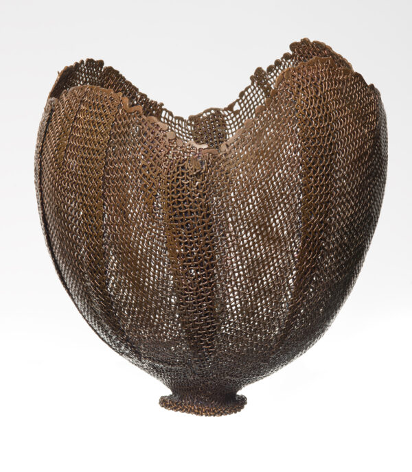 A footed, globular-shaped vessel of bronze mesh; open, irregular rim, heat-induced iridescent color