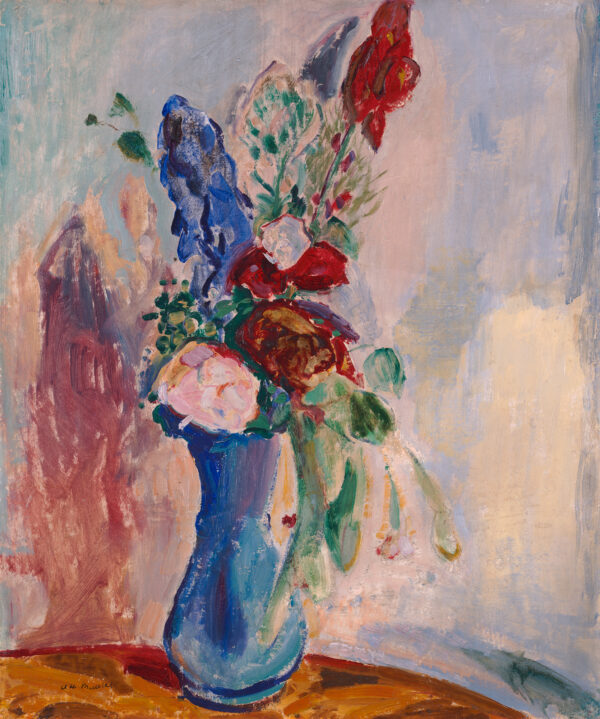 Still life bouquet of flowers in a blue vase on table.
