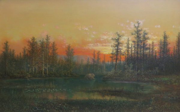 A pond is in the foreground with trees in the background before a sunset.
