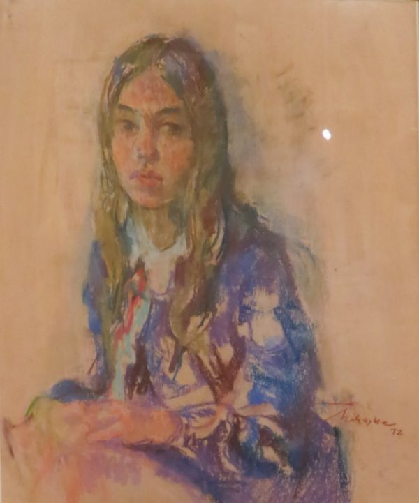 3/4 view of a young woman.