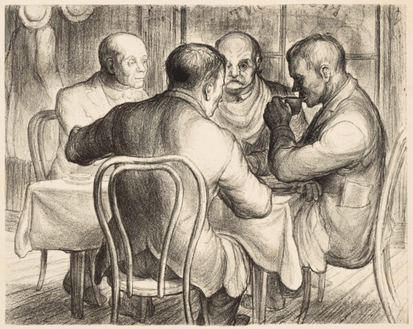 Four men sit at a table.