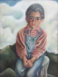 A boy sits with hands in his lap. The front of the frame has a metal tag 