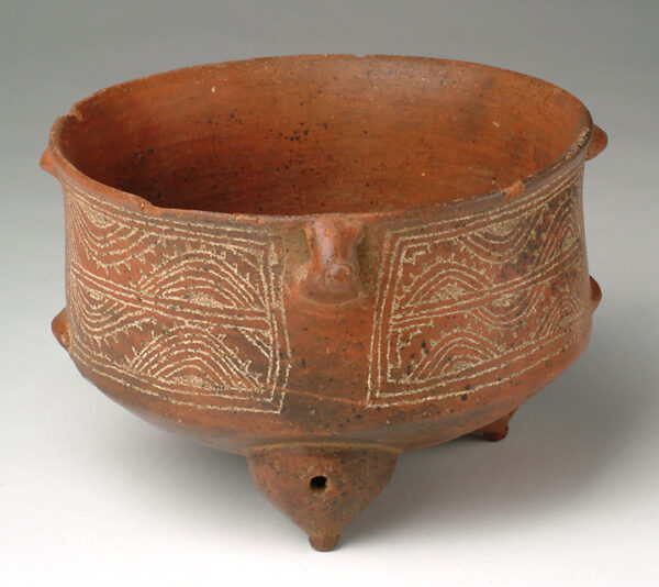 Tripod bowl with incised decoration.