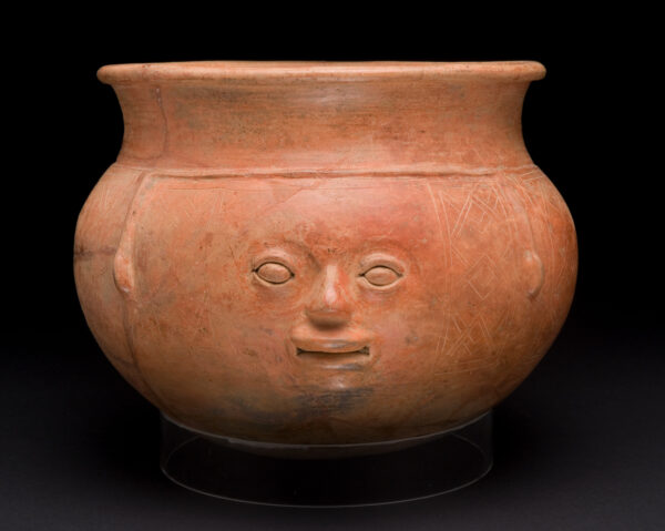 A round bowl with human face on the side.