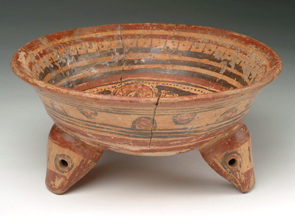 A tripod bowl with rattle legs, red and brown slip decoration.