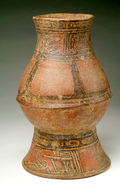 Footed jar with tan, red and black slip decoration