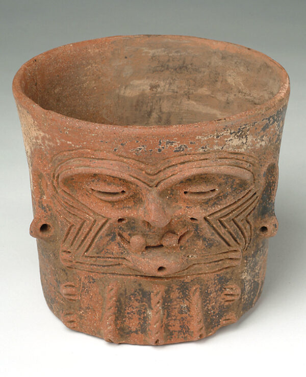 Vessel with face on side.