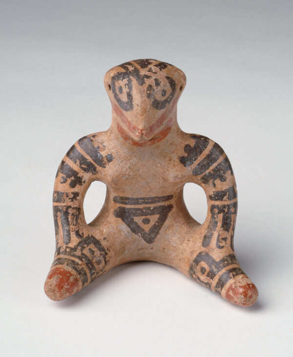 Seated figure: tan body with red and black slip decoration.