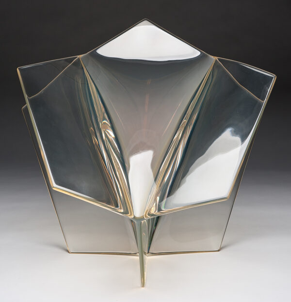 Sculpture is a pale yellow color of five intersecting planes.