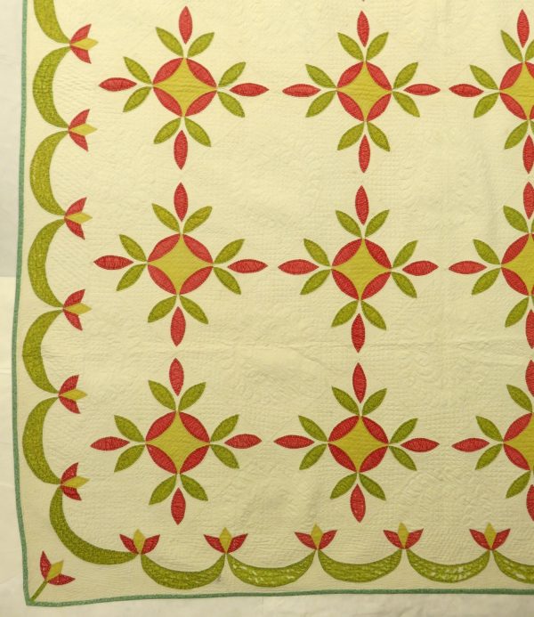 Appliqued green, yellow and red. 8-10 stitches per inch