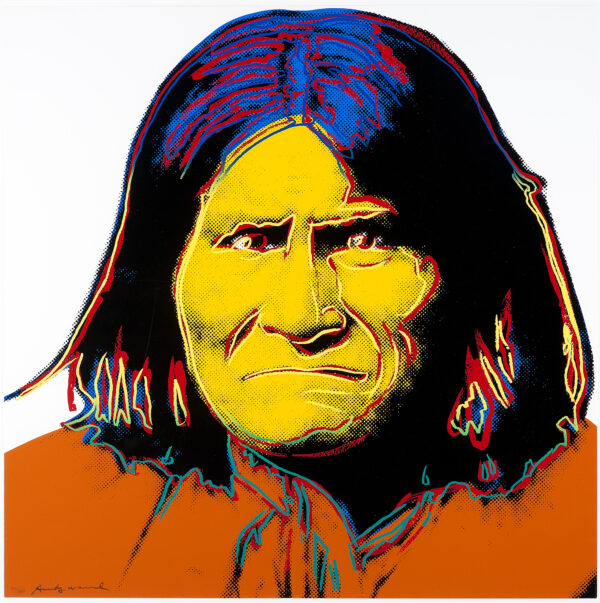 Portrait of Geronimo, head and shoulders, frontal view, yellow and orange-colored shirt.