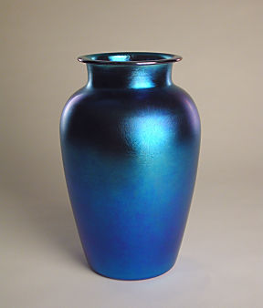 Iridescent blue urn-shaped vase with flat circular lip, narrow neck and flat base.  Pontil mark is polished.