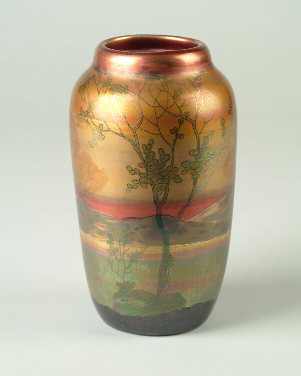 Exterior: iridescent glazes in copper, gold, red, light and dark green depicting landscape of mountains around the vase, 2 trees in foreground on each side of the vase, clouds; copper color at rim, various gold's, yellows, red in sky and clouds, greens in mountains, greens and pinks in land, green trees, dark green foreground at base. Interior: pink and white, high gloss.