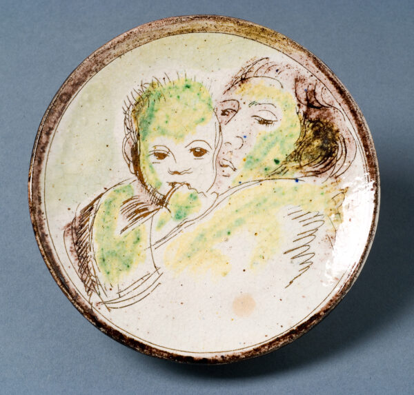 Henry's wife Bessie holding baby Peter. Inscribed below Bessie's left shoulder;