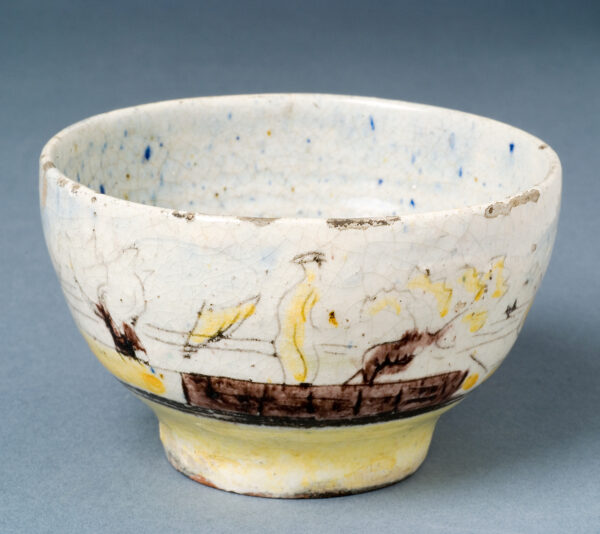 Outside of bowl: Sailboats, figures, a bird on a table, mountains. 