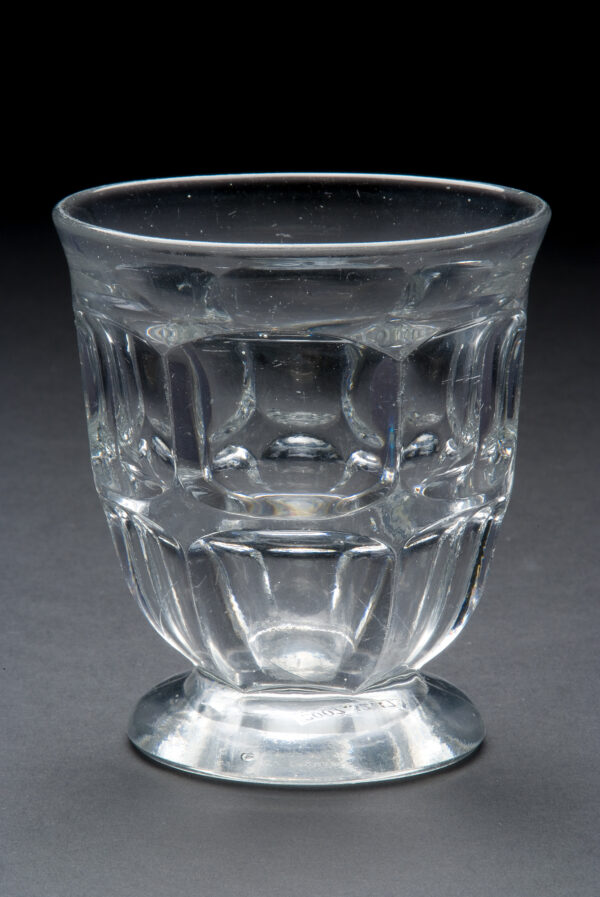 Clear footed tumbler in Excelsior pattern.