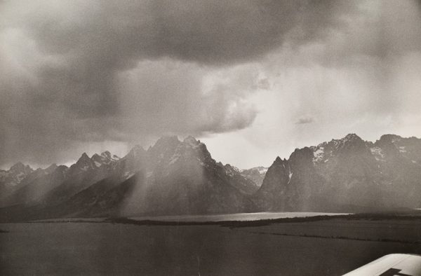 Grand Tetons with rain over the lake.