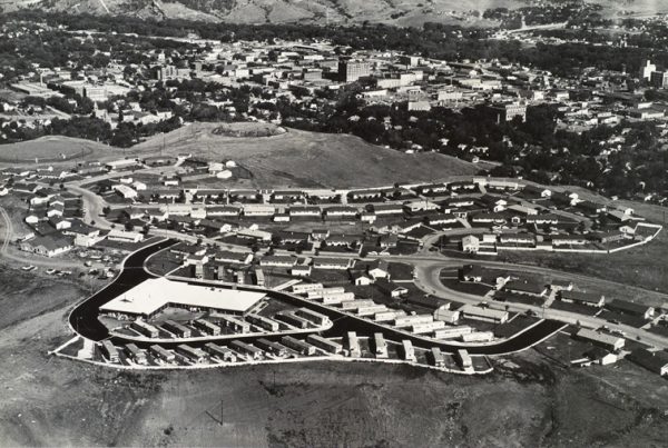 A trailer park is situated on a half circle drive with Rapid City in the background.