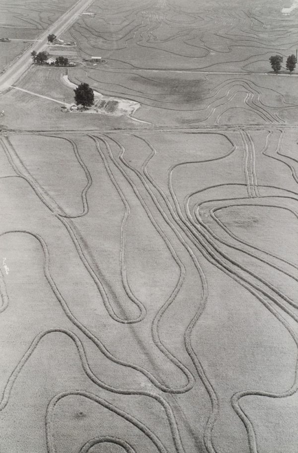 Fields with multiple wavy lines from tractors.