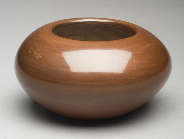 Brown (pipestone/reddish) clay, polished and undecorated