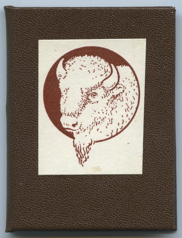 Hard-bound in brown with image of buffalo printed in red on white paper glued to front cover. A description of how rare white buffalos are.