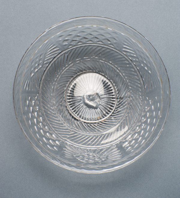 A small deep plate blown with 3-molds and folded-tooled rim.