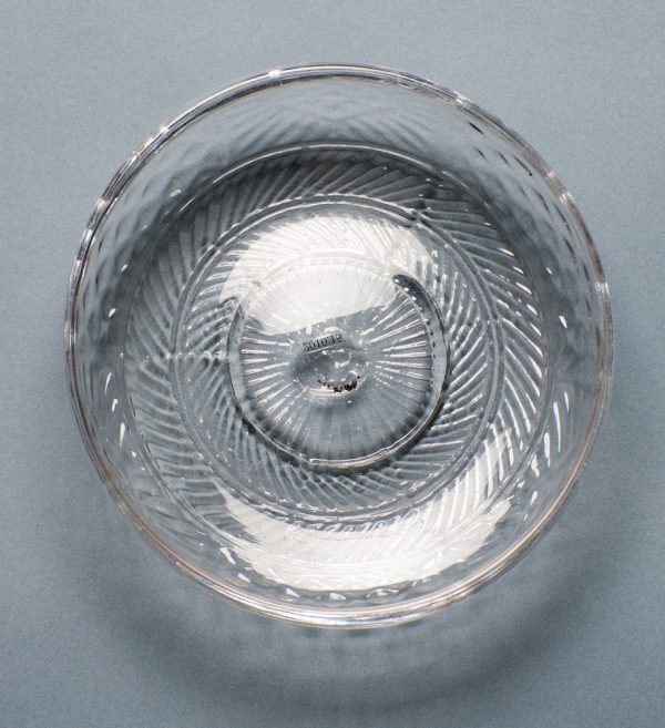 A small shallow bowl blown with 3-molds and a folded-tooled rim.