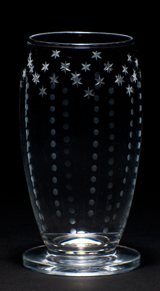 Shape T-151. A footed vase with engraved stars around the top and 8 vertical rows of dots.