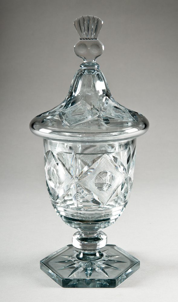 Shape #6559, An urn with lid that has finial at top. The cut designs are geometric lozenges and circles.