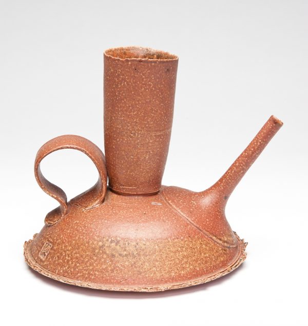 A functional thrown teapot with a salt glazed, rust colored surface. The teapot has a narrow funnel shaped spout and flat strap handle.