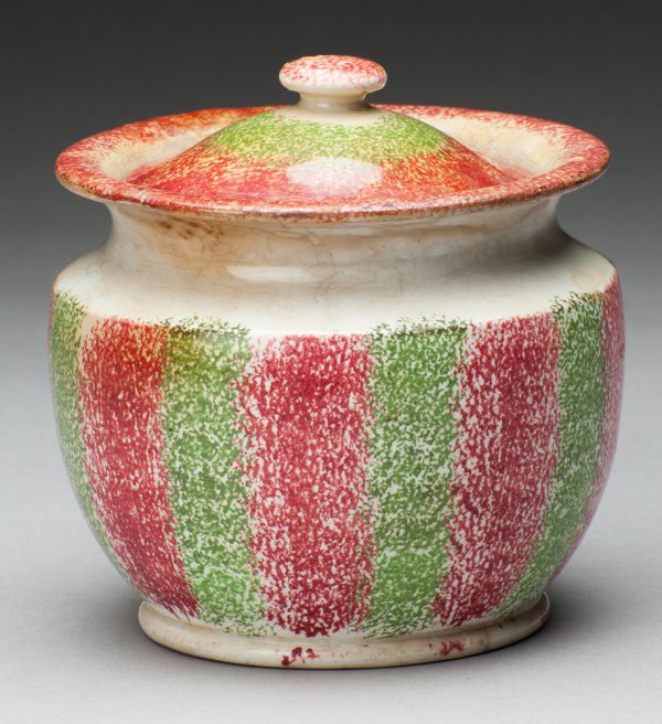 Spatterware sugar bowl in red and green stripes.
