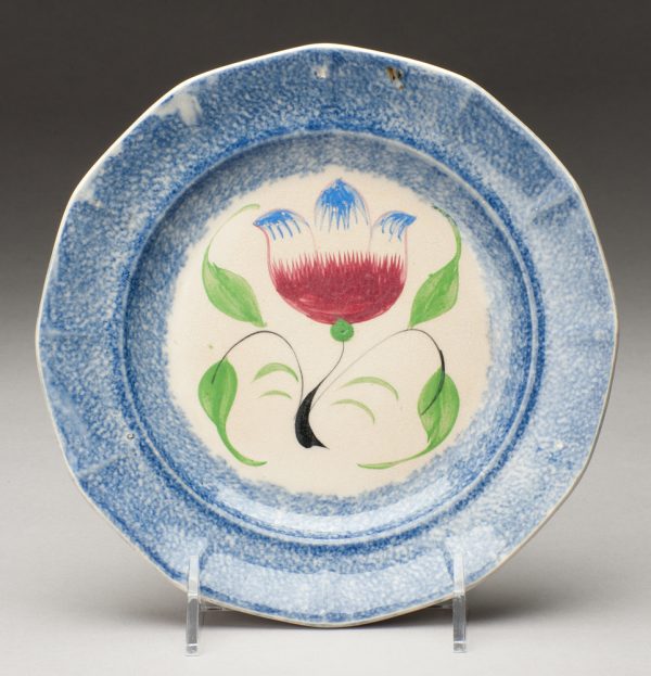 Spatterware plate in the Tulip pattern, blue with red/blue flower, green leaves