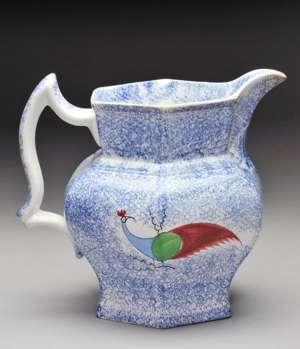 Spatterware pitcher, blue with blue/green/red/ peafowl and shell pattern below spout.