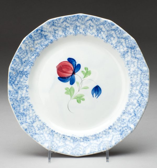 Spatterware plate in the Pomegranate  pattern, blue with red and blue flower, green leaves