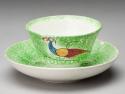 Spatterware cup, green with blue/yellow/red peafowl