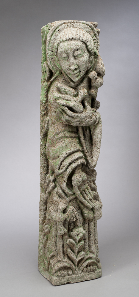 A sculpture made by sand casting concrete with vermiculite added. The image is of St. Francis who is holding a bird in his left hand and feeding others with his right hand. Another bird is at his left ear. The natural concrete color has been accentuated with green touches of paint throughout.