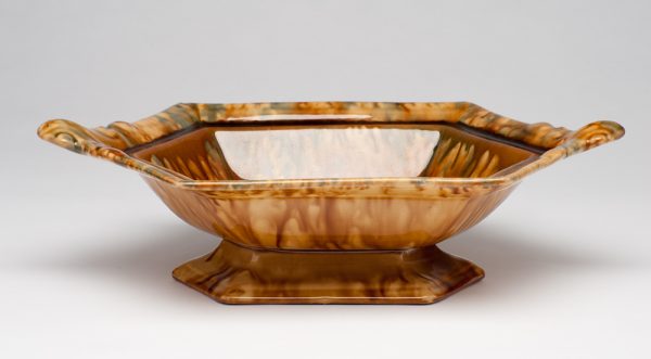 Six sided serving dish with tan, green and brown mottled surface