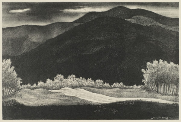 A moonlit scene of dark foreground and mountains behind a brightly lit road running from lower right to center. There are several bright clouds in the dark sky.